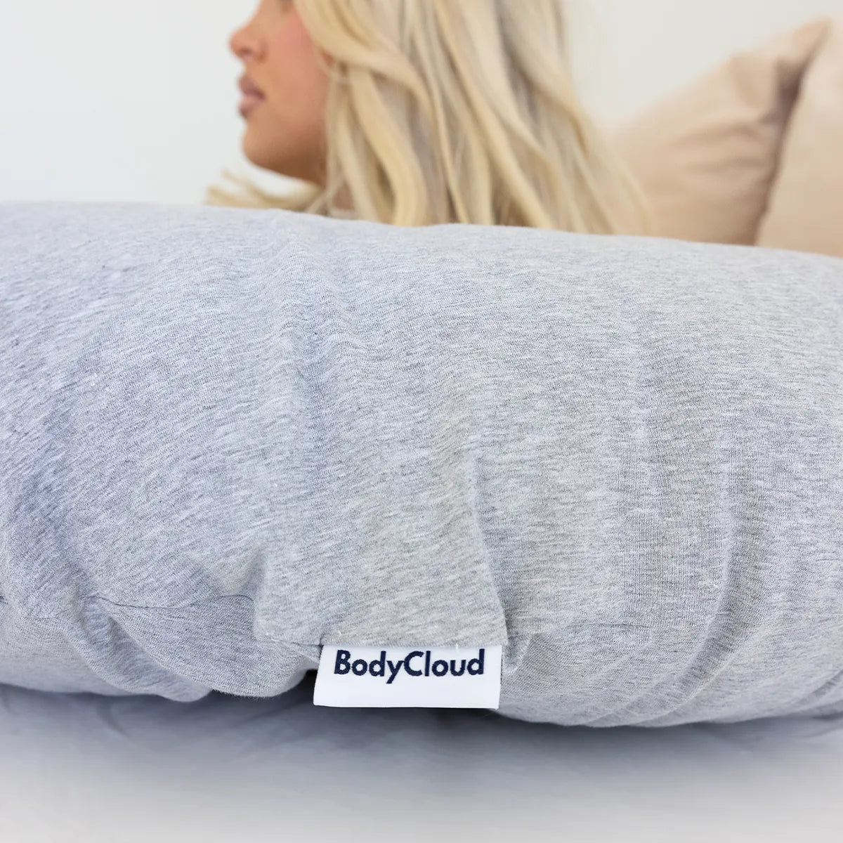 Close up image of BodyCloud embroidered logo on pillow